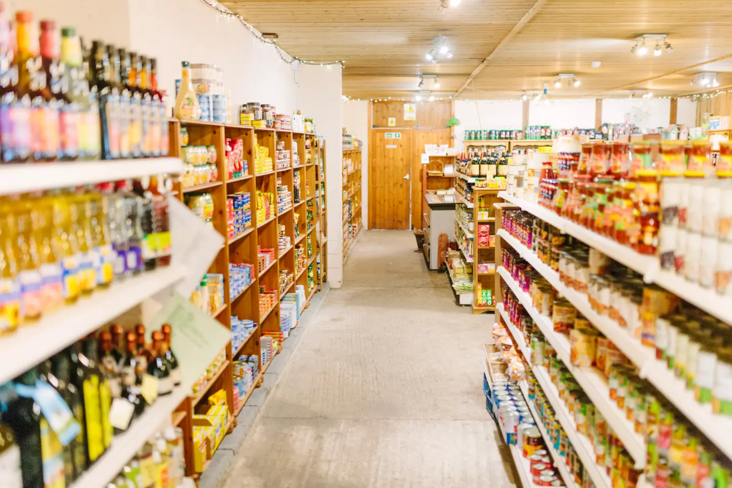 A grocery store aisle filled with various products on shelves.